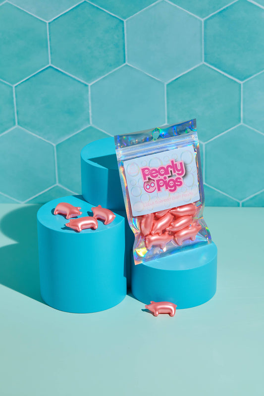 Cochons nacrés. Lot de 10 perles de bain en forme de cochon. Parfum de lotus. Bare Boutique